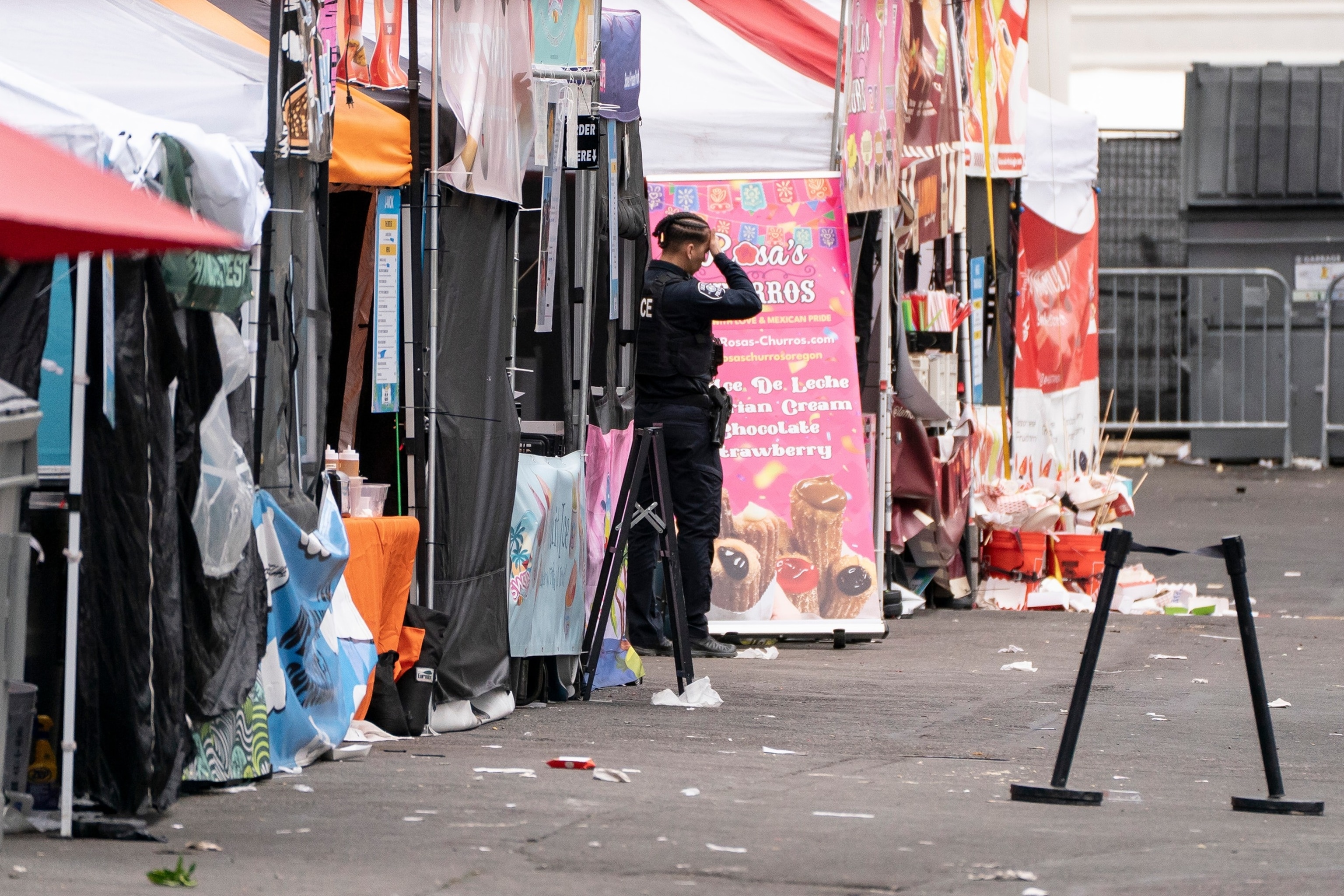 A police officer stands near abandoned vendor booths after a shooting occurred at the Bite of Seattle food festival on July 26, 2026 in Seattle, Washington.David Ryder/Getty Images