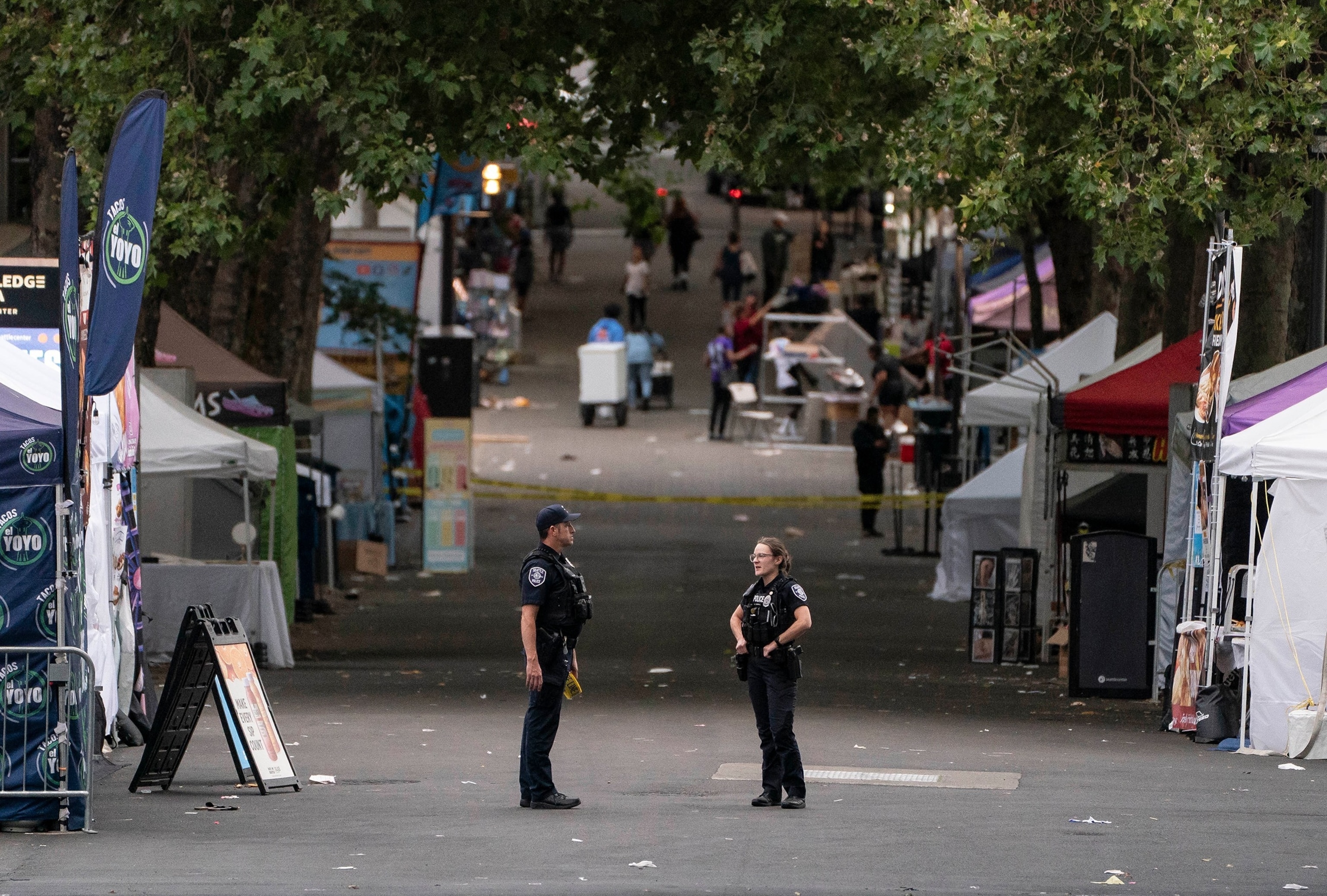 Police officers keep watch after a mass shooting at the Bite of Seattle food festival on July 26, 2026 in Seattle, Washington.David Ryder/Getty Images