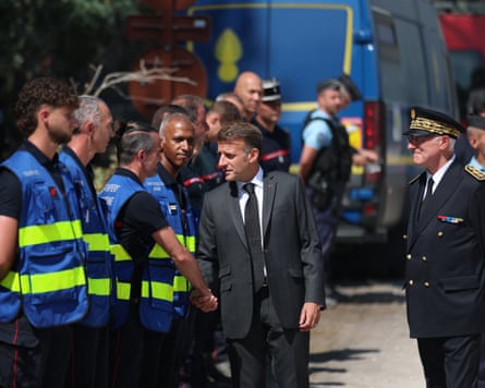 Emmanuel Macron meets forest police and firefighters in Noisy-sur-Ecole, near Fontainebleau.Photograph: Mohammed Badra/Pool EPA/AP