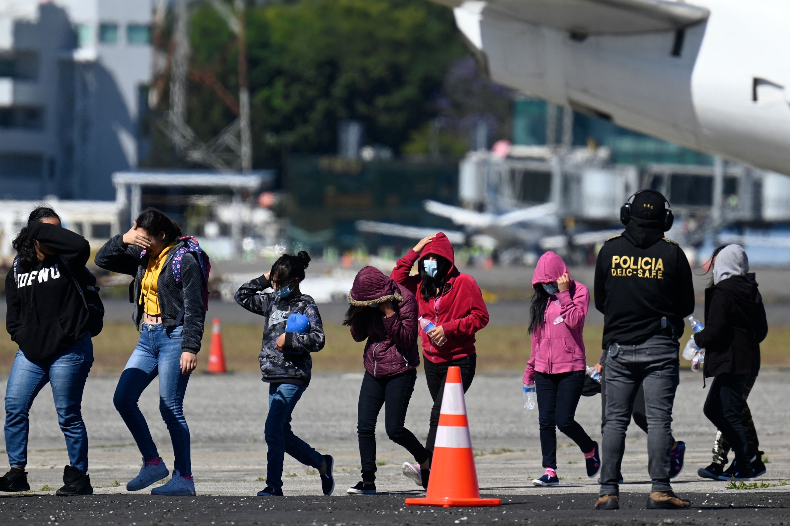 In this Feb. 7, 2023, file photo, part of a group of 92 unaccompanied Guatemalan migrant minors who were deported from Mexico arrive to their country at the Air Force Base in Guatemala City. The minors were stopped in the border between Mexico and United States, according to reports from the Guatemalan State Migration Institute.Johan Ordonez/AFP via Getty Images, FILE