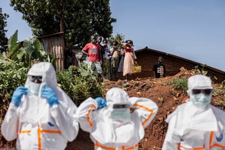 Health workers prepare for a safe burial operation in the community of Mongbwalu, Ituri, DRC, in May.Photograph: Michel Lunanga/Getty Images