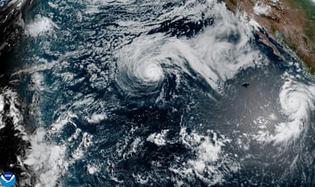 Satellite image shows Hurricane Genevieve swirling off the south-west coast of Mexico, over the Pacific Ocean, on 26 July.Photograph: NOAA/AP