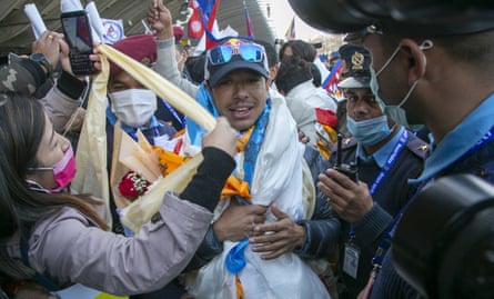 Purja, after being part of the all-Nepali mountaineering team that became the first to scale K2 in winter, arrives at Tribhuwan international airport in Kathmandu in January 2021.Photograph: Niranjan Shrestha/AP
