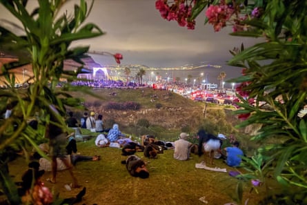 People waiting on the Moroccan side of the border for a chance to cross to Ceuta.Photograph: Reuters