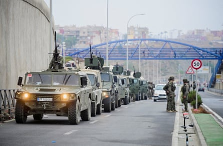 Spanish soldiers patrolling at the Spanish-Moroccan border in Ceuta on Friday.Photograph: Fabian Bimmer/Reuters