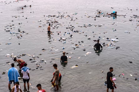 Belongings float in the sea after they were left behind by people crossing from Morocco into Ceuta.Photograph: Antonio Sempere/AP