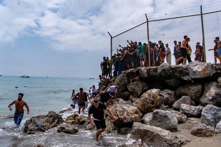 The border crisis boiled over Thursday and continued on Friday with security forces clashing with migrants on the Moroccan side of the border.Antonio Sempere / AP