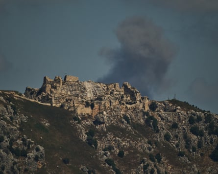 Smoke rises behind Beaufort Castle in Lebanon after an Israeli military strike in June. The area was hit by Israel again on Friiday in a massive explosion that covered towns in ash.Photograph: Léo Corrêa/AP