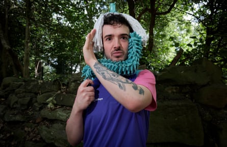 Miller with his dance partner, Doris the mop.Photograph: Mark Pinder/The Guardian