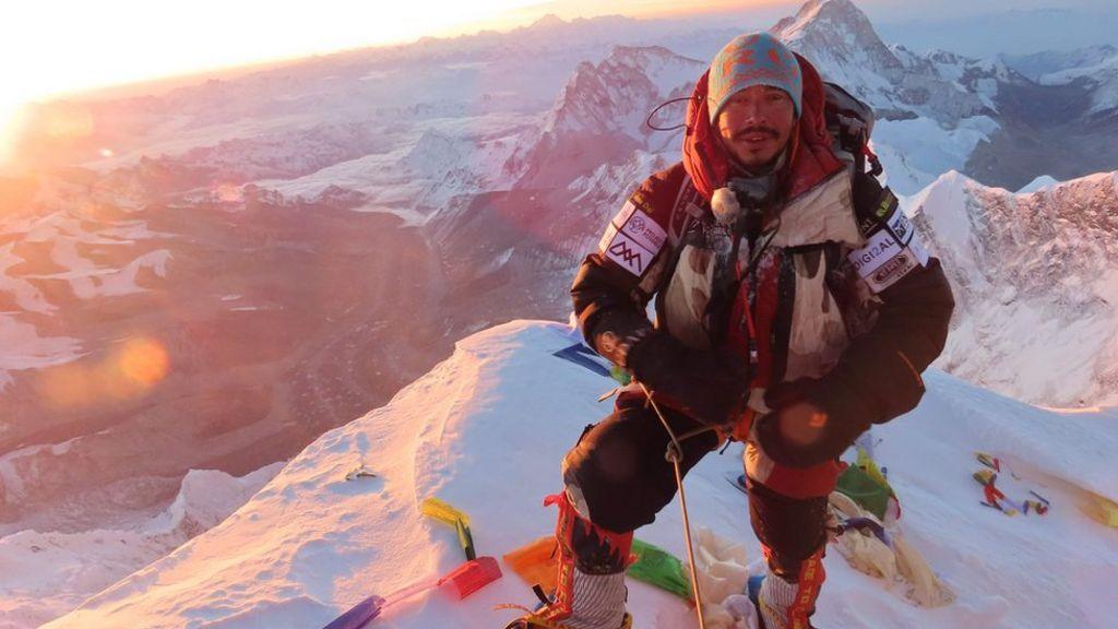 Image caption,Nirmal Purja at the summit of Mount Everest
