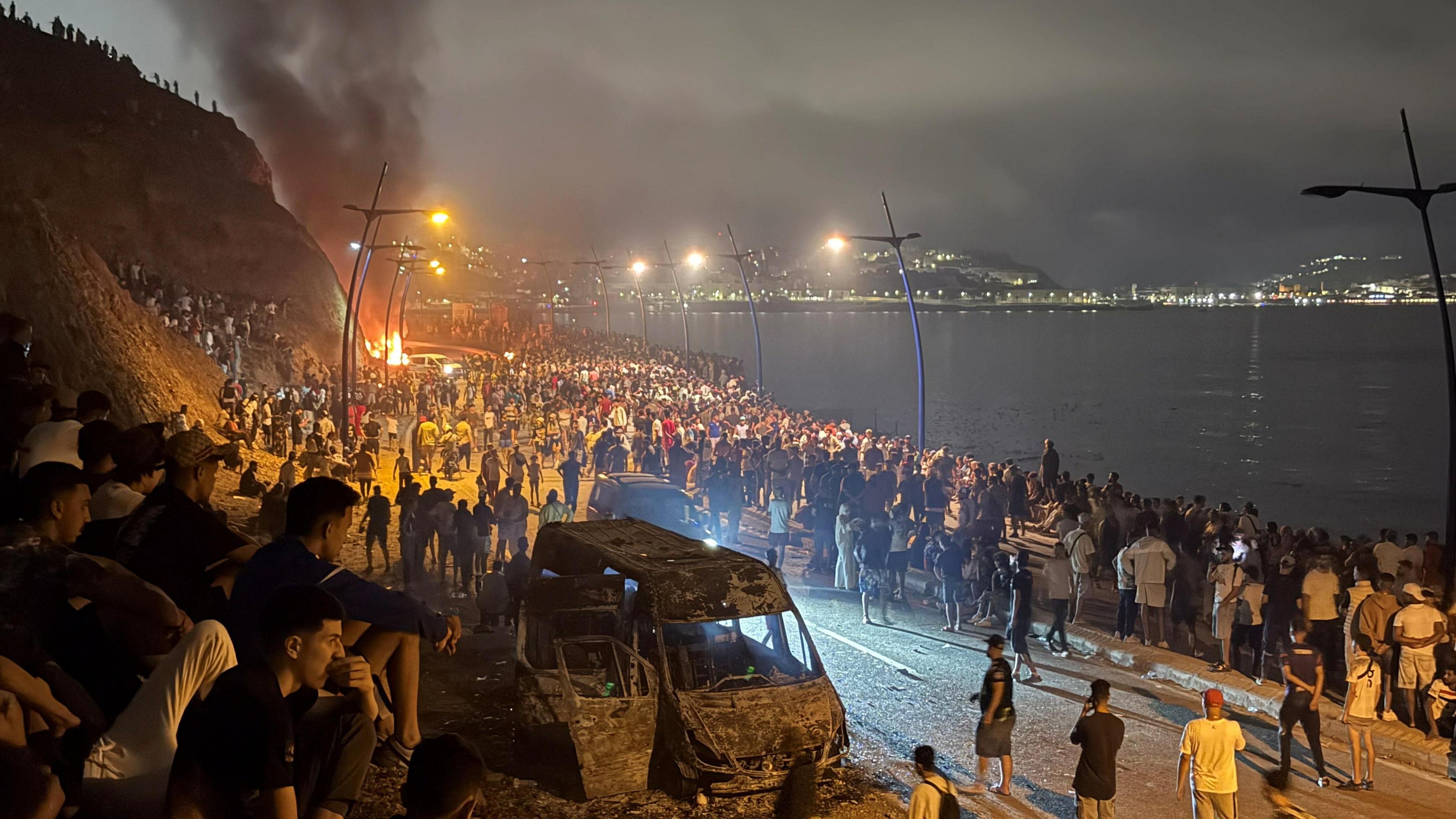 Image caption,Crowds gathered at the border between Morocco and Spain overnight