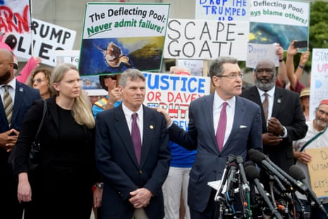 Former Olympic canoeist David Hearn, second from left, listened as his lawyer, Norm Eisen, spoke after he pleaded not guilty on 9 July to allegedly damaging the Lincoln Memorial reflecting pool.Photograph: Rod Lamkey/AP