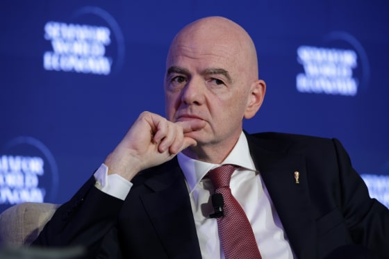 U.S. President Donald Trump and FIFA President Gianni Infantino wave during the award ceremony of the 2026 World Cup final at the New York/New Jersey Stadium on July 19.Franck Fife / AFP via Getty Images file