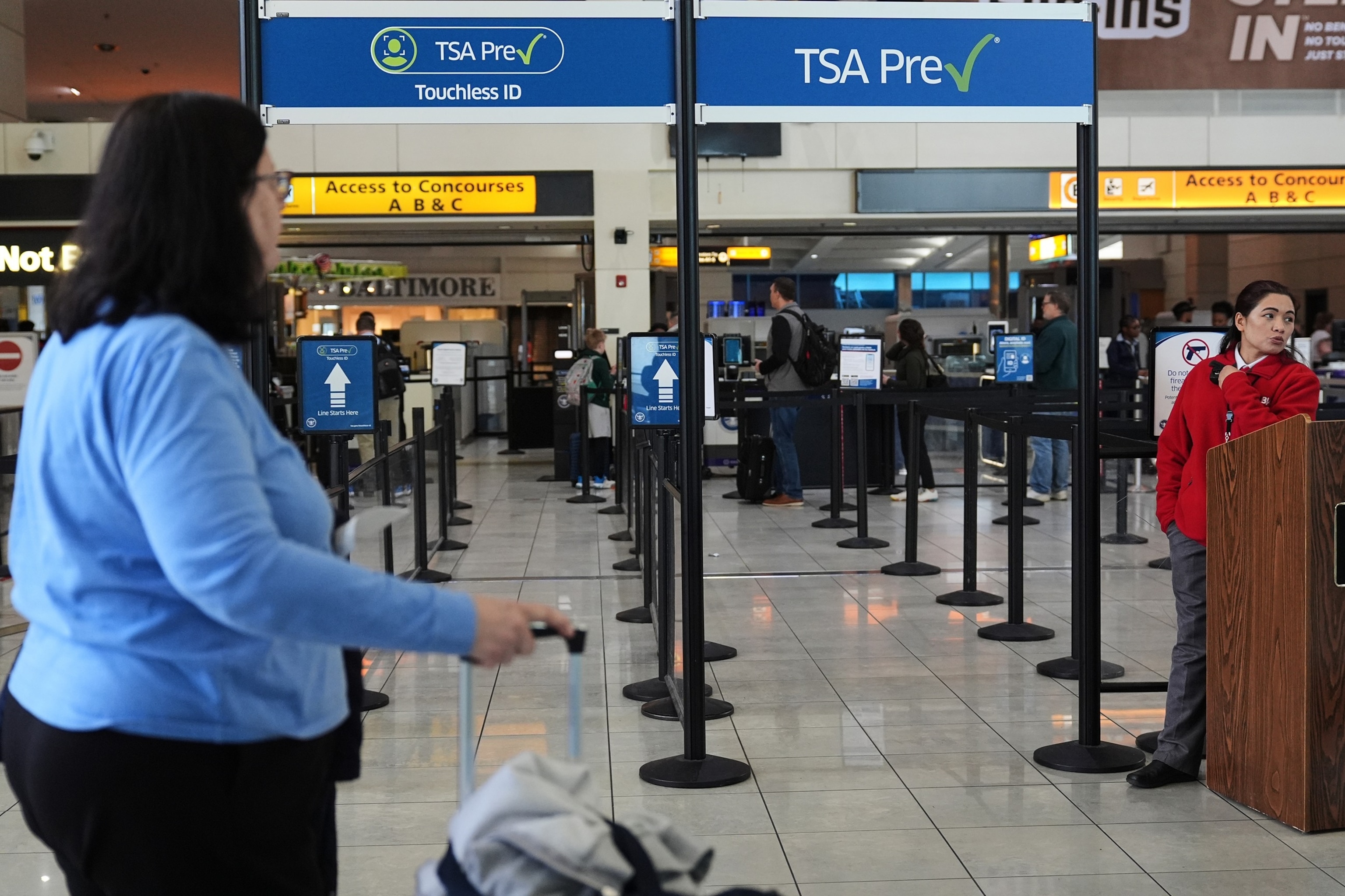 Travelers enter the line for security with TSA PreCheck at Baltimore/Washington International Thurgood Marshall Airport in Baltimore, Thursday, March 19, 2026.Stephanie Scarbrough/AP