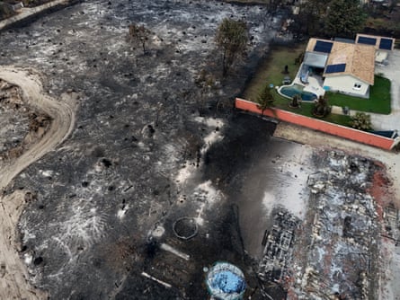 Fire engines near the smoke and flames in Le Porge.Photograph: Stéphane Mahé/Reuters