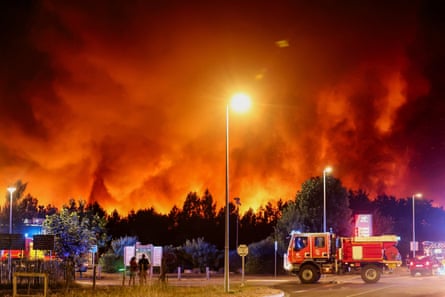 Fire lights up the night after ripping through a pine forest near Le Porge.Photograph: Le Gonidec Margot/Abaca/Shutterstock