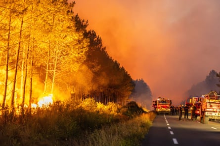 The wildfire turns the sky red over Lake Moutchic in Lacanau. The popular tourist destination had to be shut down.Photograph: Sapte Fabrice/Abaca/Shutterstock