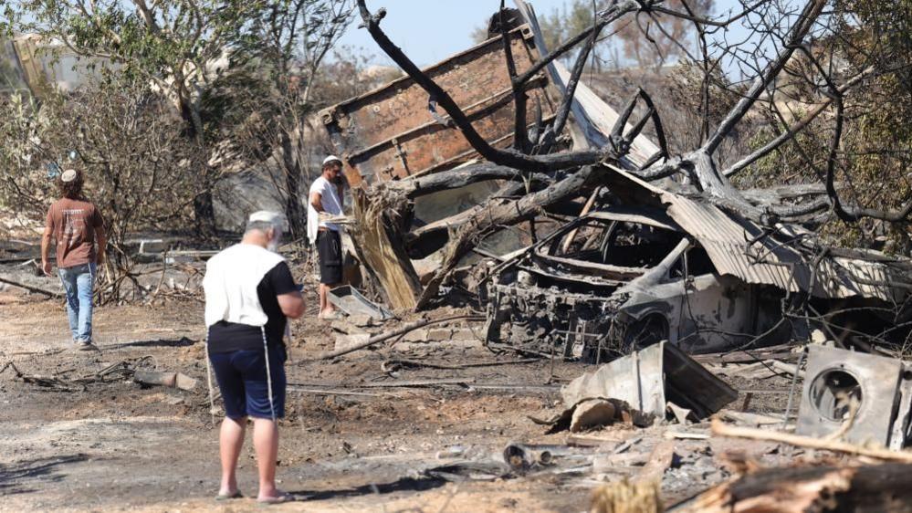 Image caption,Settlers at Havat Gilad say houses there were burnt down by Palestinians. Police say the cause was accidental.