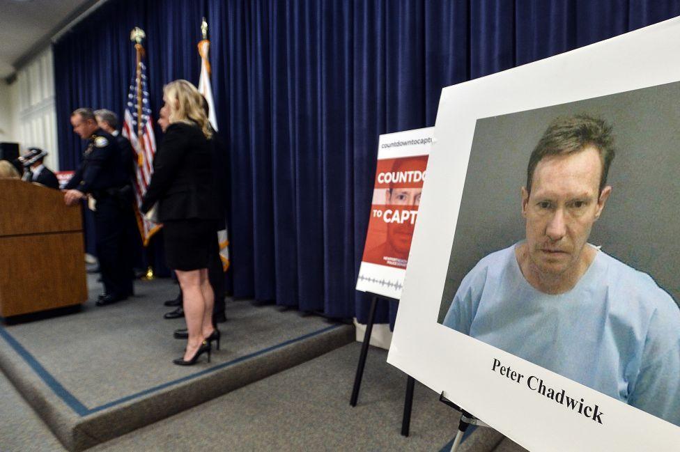Image caption,A picture of Peter Chadwick mounted on a board during a police press conference