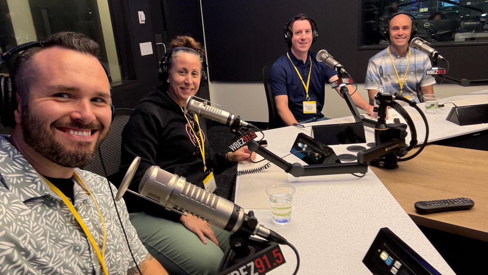 Image caption,Andrew Houghton (second from right) and Matthew Vartarian (on far right) chat to Elgin's police chief, Ana Lalley for their podcast Somebody Knows Something