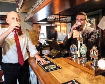Andy Burnham and the chancellor, John Healey, visit a pub during a trip to Essex. The report found alcohol was embedded in networking, lobbying and socialising for those working in Westminster.Photograph: Richard Pohle/Pool Times Media Ltd/AP