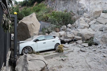 A woman walking through a closed street in Pozzuoli the day after the earthquake.Photograph: Anadolu/Getty Images
