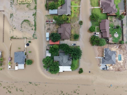 An aerial view shows flooding in mid-July in Ozona, Texas.Photograph: Gerald Herbert/AP
