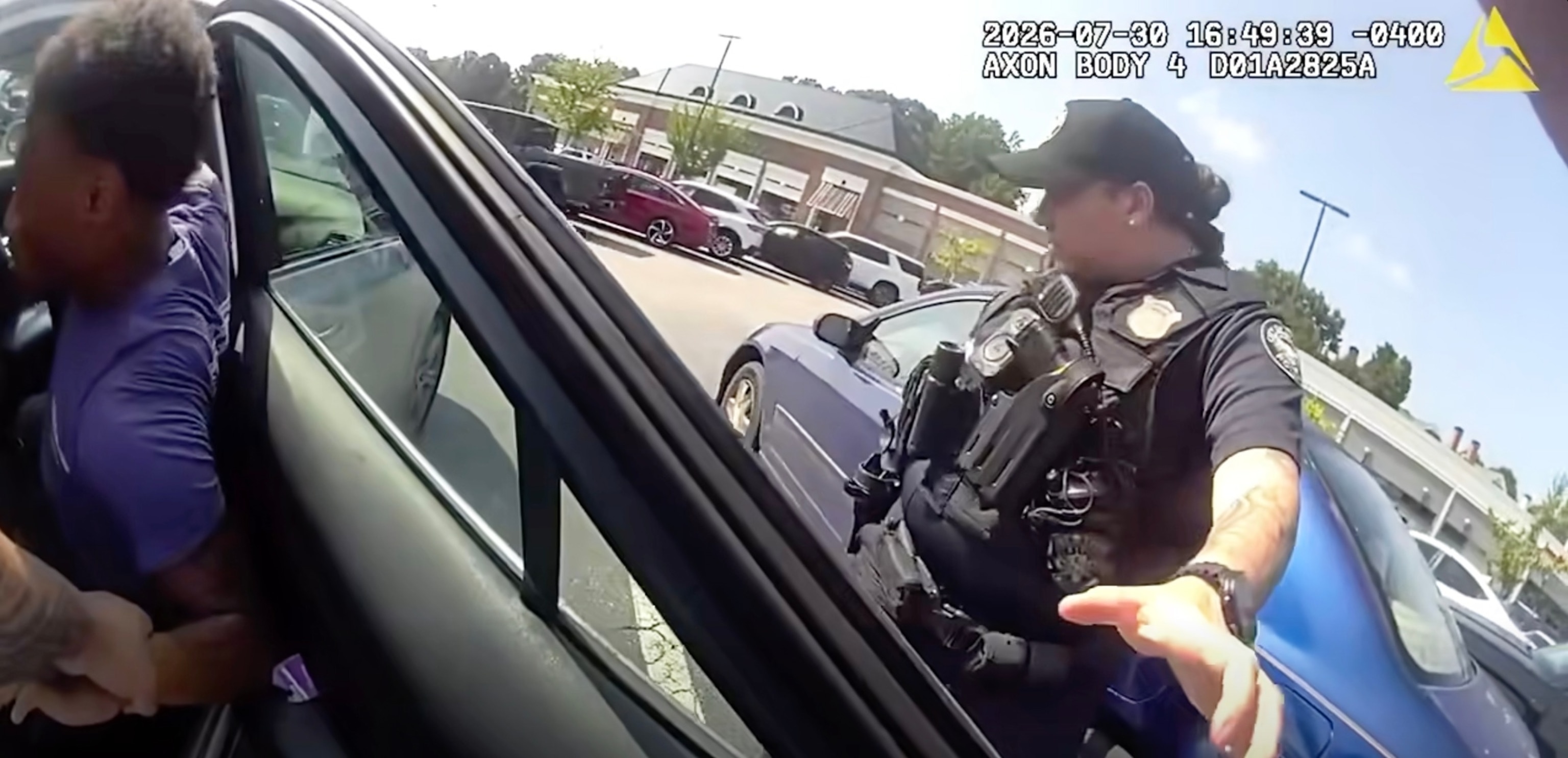 This screen grab from body cam footage released by the Atlanta Police Department shows an arrest after the theft of a car with a child still in it.Atlanta Police Department