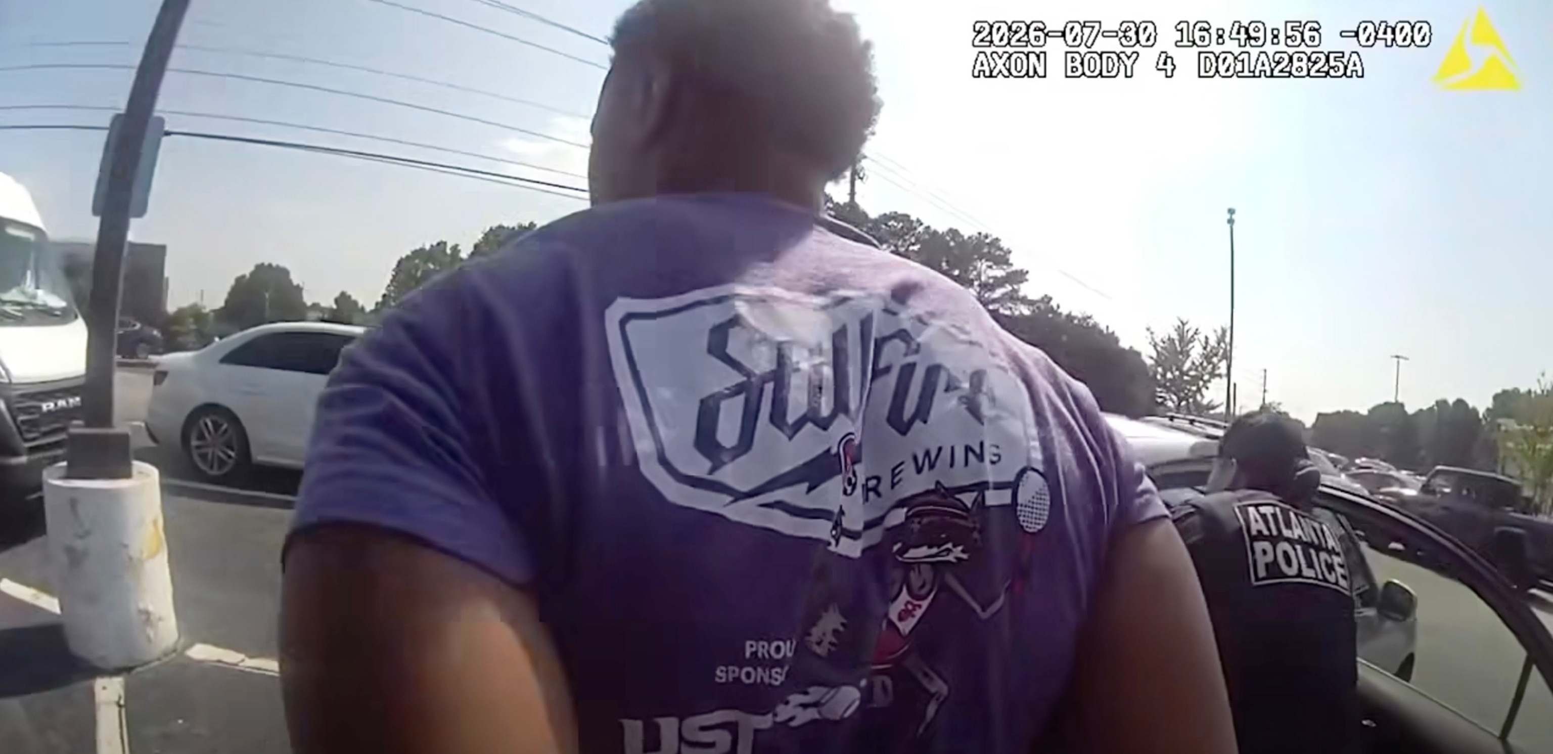 This screen grab from body cam footage released by the Atlanta Police Department shows an arrest after the theft of a car with a child still in it.Atlanta Police Department