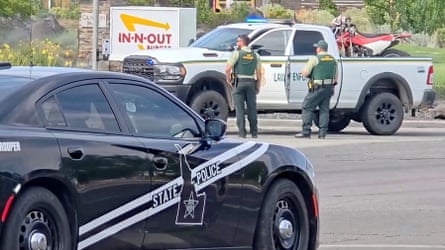 Police at the In-N-Out restaurant, which recently opened on 24 July.Photograph: Abc Affiliate Kivi/Reuters