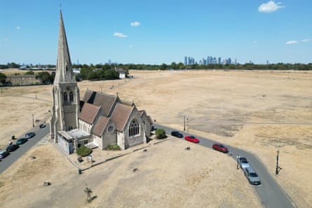 All Saints church surrounded by the scorched grass of Blackheath Common in south-east London.Photograph: Justin Tallis/AFP/Getty Images