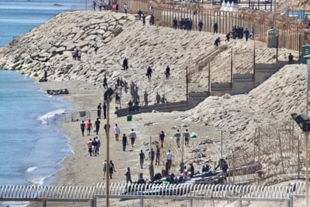 People returning to Morocco on Sunday after crossing into Ceuta.Photograph: Reduan Dris/EPA