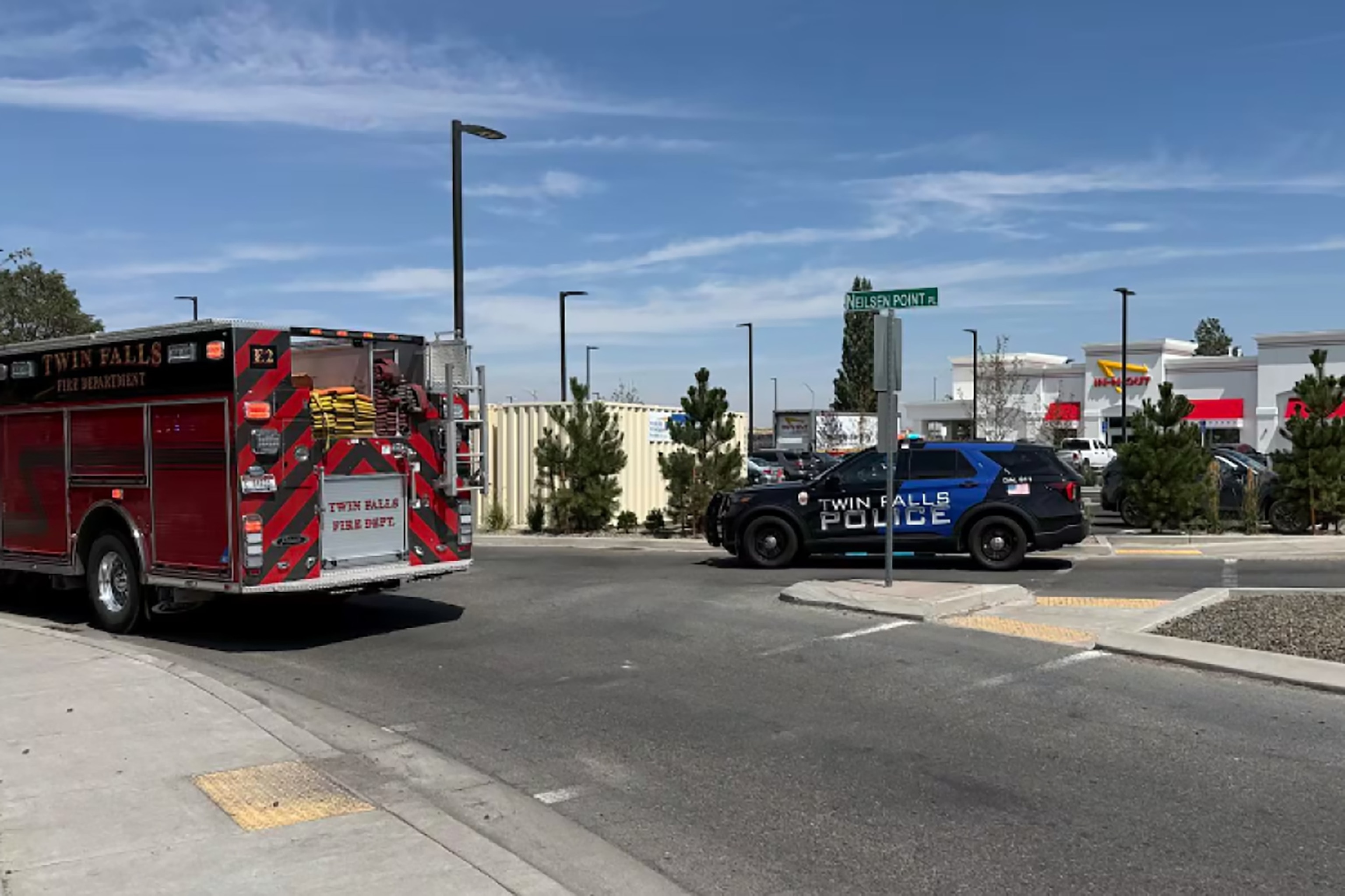 This image provided by KMVT shows the scene of a shooting that started at an In-N-Out Burger restaurant, Saturday, Aug. 1, 2026 in Twin Falls, Idaho.KMVT via AP