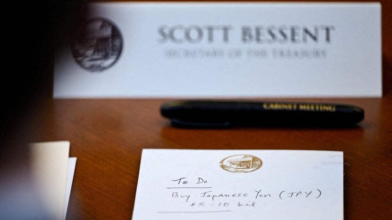 Image caption,A notepad photographed in front of US Secretary of the Treasury Scott Bessent on Friday
