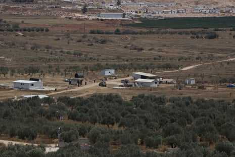 An Israeli military Jeep patrols an illegal outpost built by Israeli settlers after they took control of private farmland owned by the people of Turmus Ayya.Photograph: Quique Kierszenbaum/The Guardian