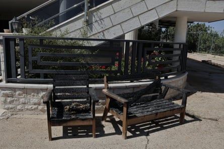 Benches outside Ali’s home in Deir Dibwan that were set on fire in an arson attack.Photograph: Quique Kierszenbaum/The Guardian