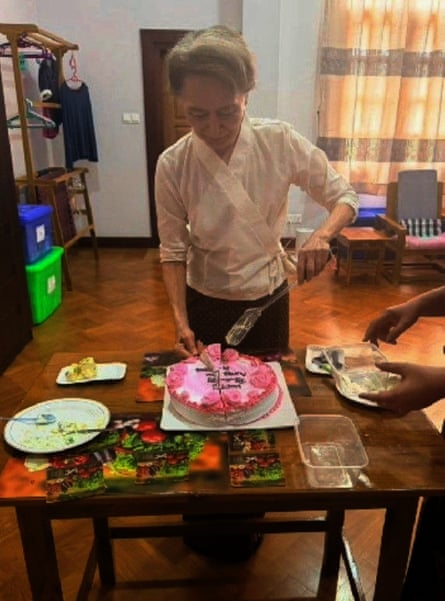 Photo released by Myanmar’s government shows Aung San Suu Kyi cutting a birthday cake during her meeting with Arnaud de Baecque.Photograph: Myanmar President Office/AP