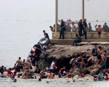 People arriving in Ceuta from Morocco last week. Tens of thousands of people arrived in the Spanish territory, the vast majority of whom have already been sent back.Photograph: Reduan Dris/EPA