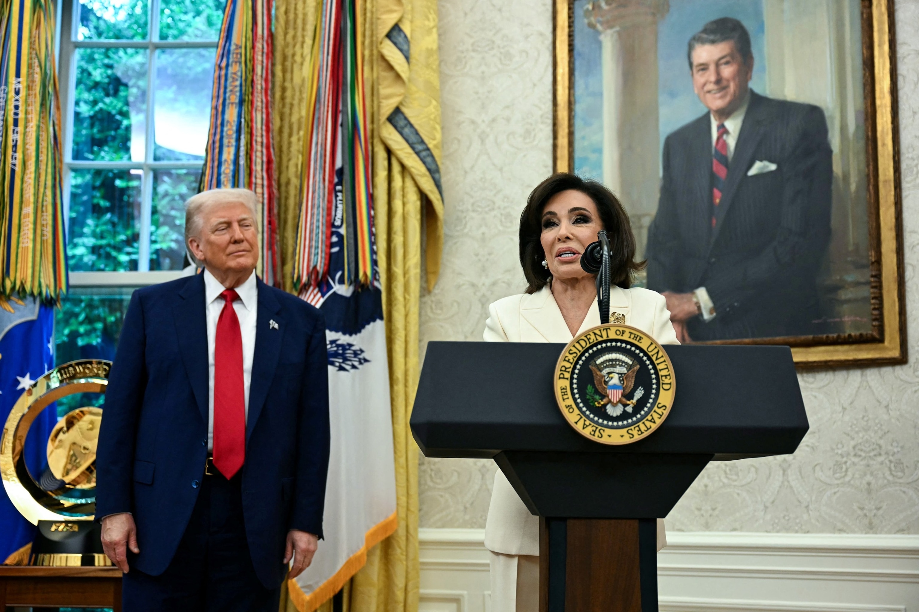 President Donald Trump listens asUS Attorney for the District of Columbia Jeanine Pirro speaks during her swearing in ceremony in the Oval Office of the White House in Washington, May 28, 2025.Jim Watson/AFP via Getty Images