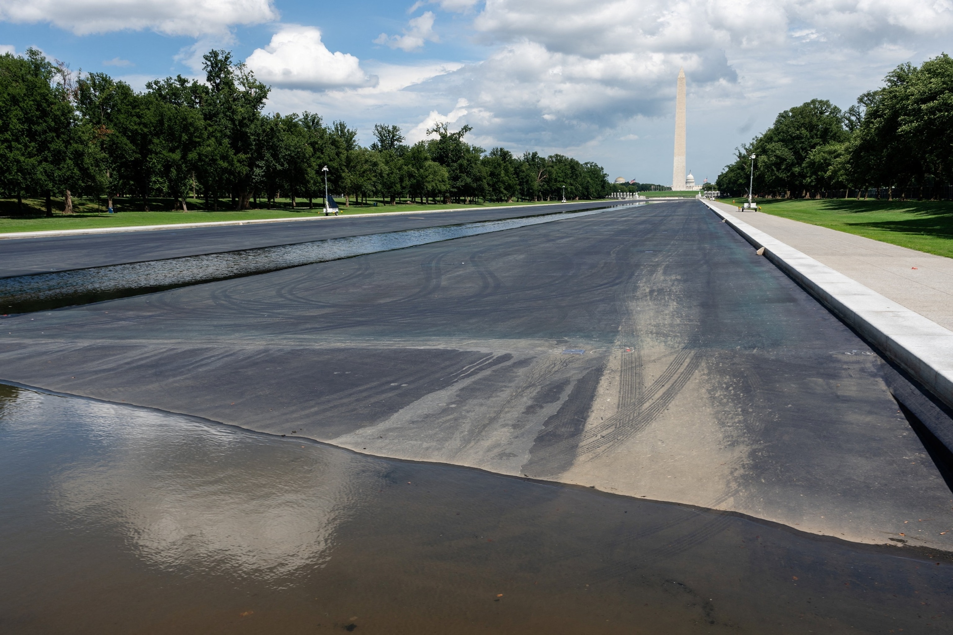 Tire marks and water are seen in the Lincoln Memorial Reflecting Pool in Washington, August 3, 2026.Eric Lee/Reuters