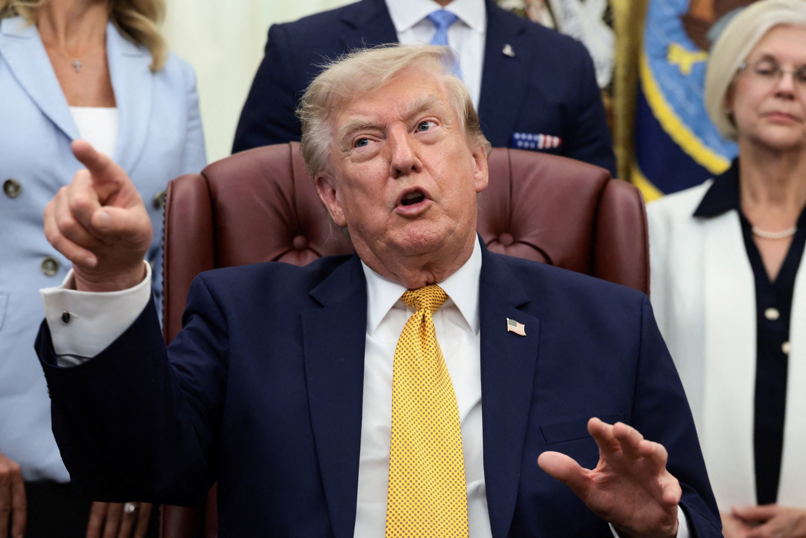 President Donald Trump points his finger as he answers questions from the media after signing an executive order establishing the President's Military Spouse Commission in the Oval Office at the White House in Washington, August 3, 2026.Evelyn Hockstein/Reuters
