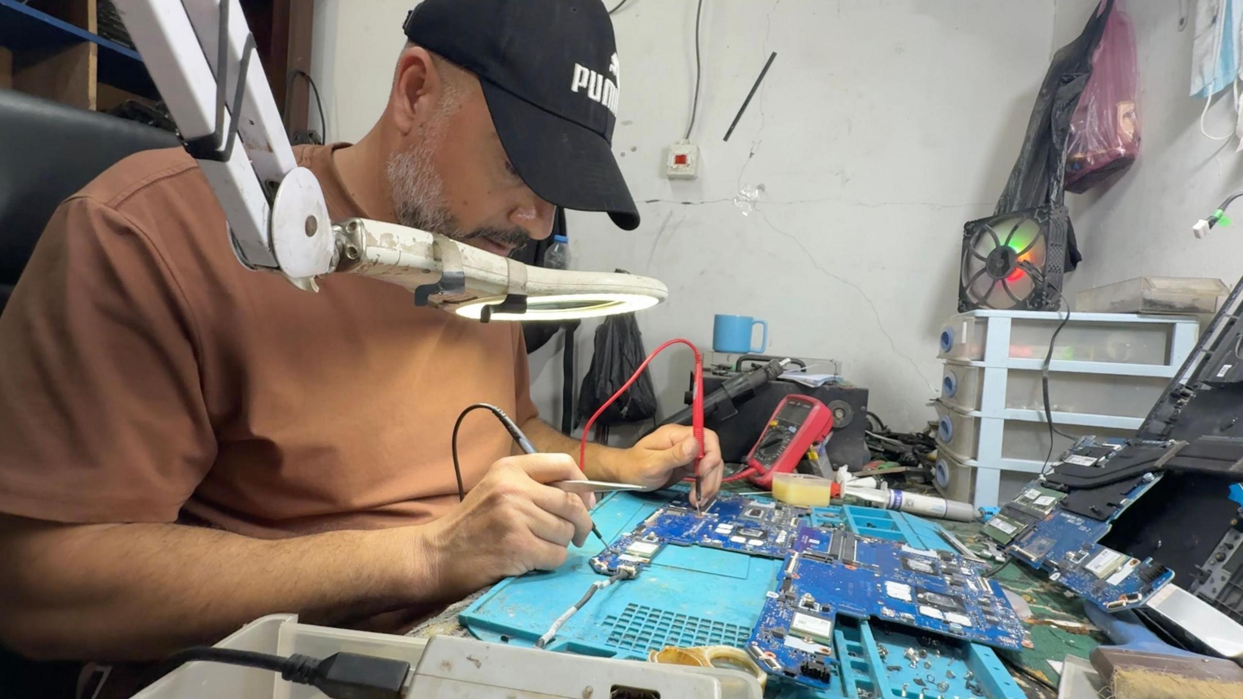 Image caption,Workshops do their best to repair computers with spare parts from damaged devices