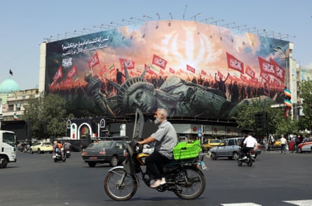 An anti-US billboard at Enghelab Square in central Tehran, Iran.Photograph: Abedin Taherkenareh/EPA