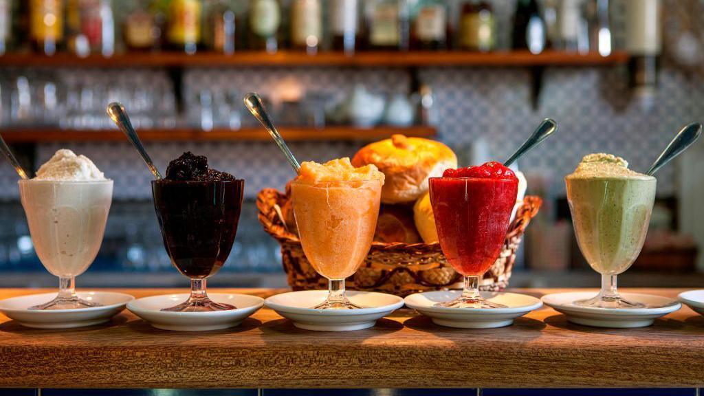 Image caption,Enjoying a Sicilian granita - or Rome's grattachecca - is another way to stay cool