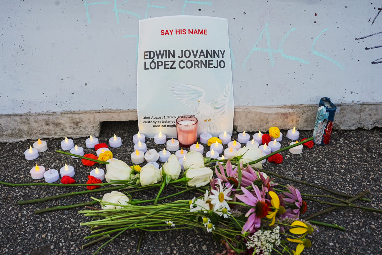Flowers and candles laid at a memorial site for Edwin Lopez-Cornejo during a vigil at Delaney Hall Detention Facility in Newark, N.J., on Monday.Selcuk Acar / Anadolu via Getty Images