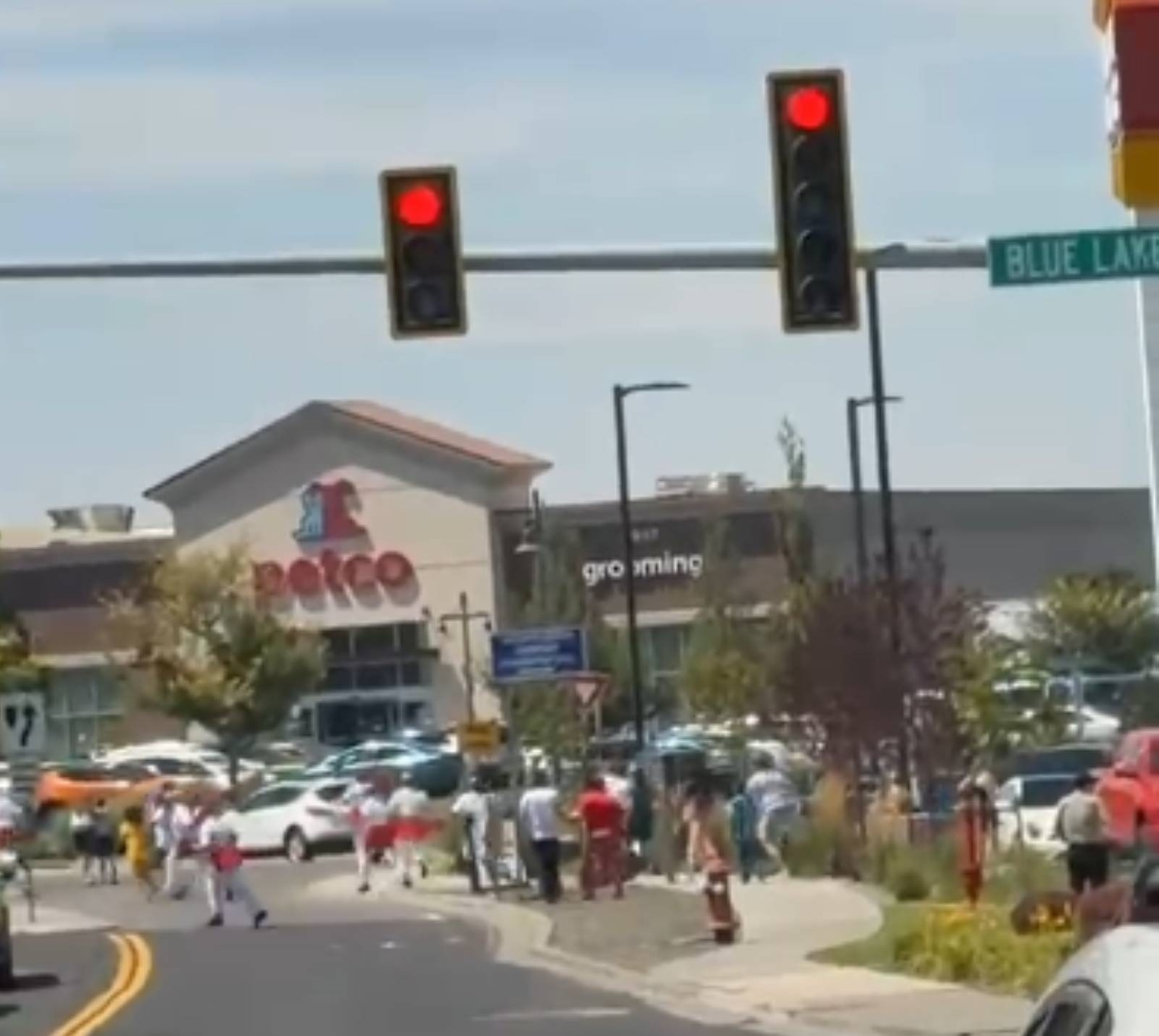In this still image from a video, people are seen running at a shopping center in Twin Falls, Idaho, near the scene of a reported shooting at an In-N-Out location.One_takeKev