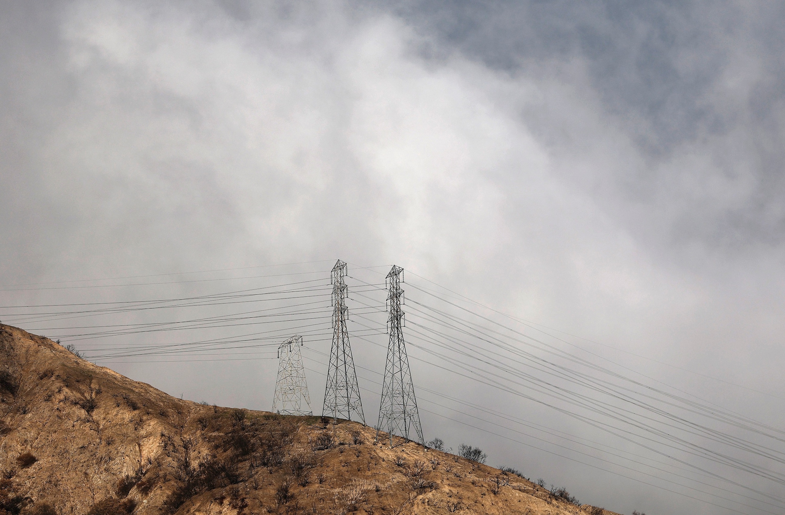 Southern California Edison transmission towers stand in an area that burned during the January 2025 Eaton Fire in Altadena, California.Mario Tama/Getty Images