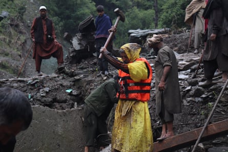 Rescue teams search for missing people in Murrah village after the cloudburst-triggered landslide.Photograph: Ishtayaq Rasool