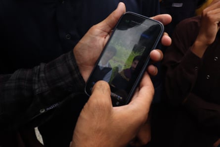 A photograph on a phone of 16-year-old Sajjad Ahmed, whose body remains missingPhotograph: Ishtayaq Rasool