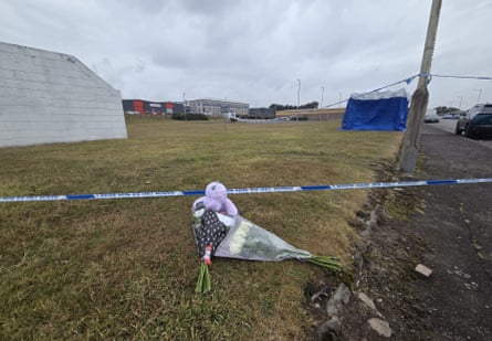 Tributes left at the Elliot industrial estate, where Minnie Merriman was found.Photograph: Rachel Keenan/PA